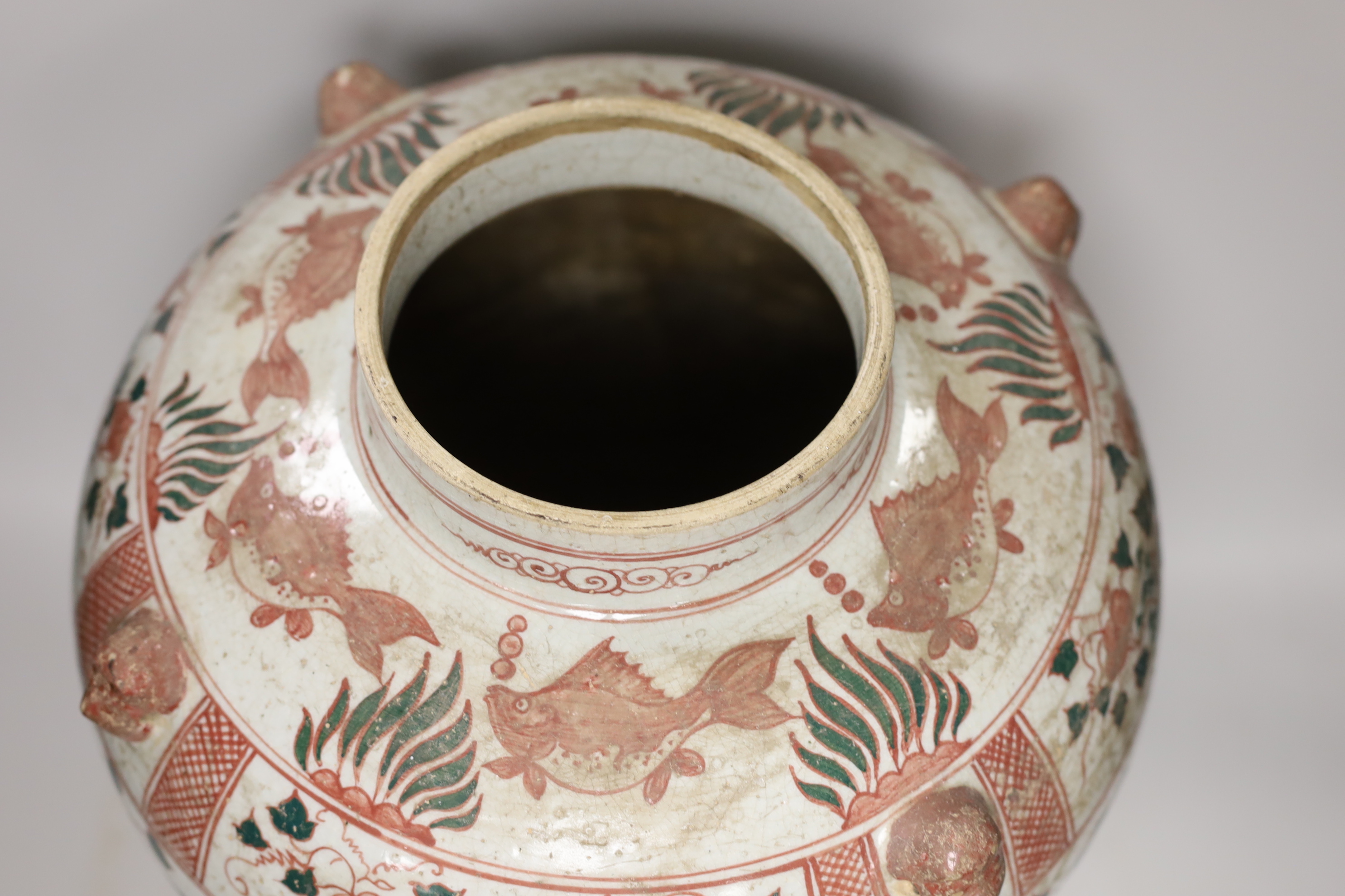 An Annamese enamelled porcelain ‘fish’ jar, 43cm high